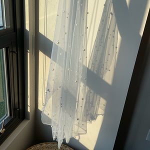 Pearl white fingertip wedding veil with comb